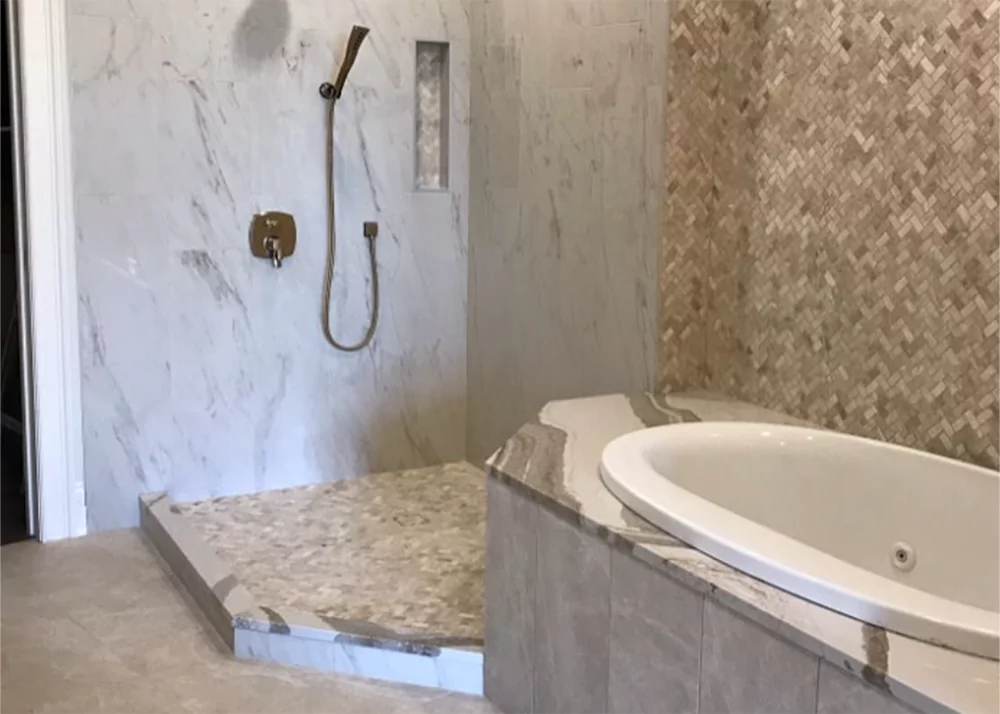 Stone-look bathroom tile installation by Aesthetic Tile