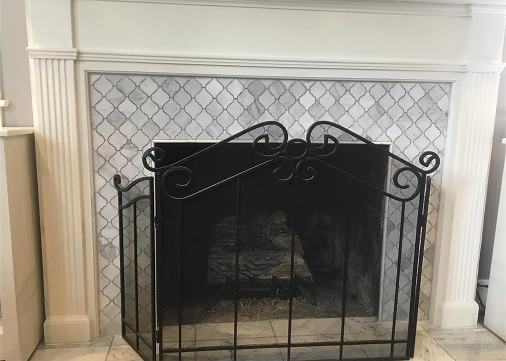 Textured ceramic square tile fireplace surround installation in Groveland, FL by Aesthetic Tile