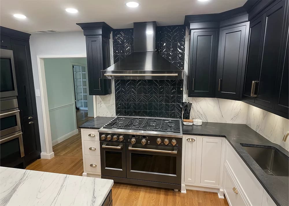 Completed dark kitchen backsplash tile installation by Aesthetic Tile