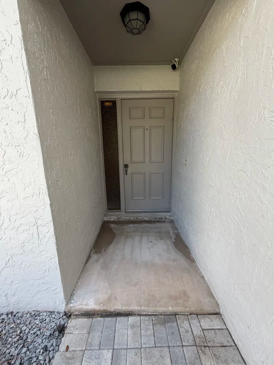 Exposed porch surface before tile installation