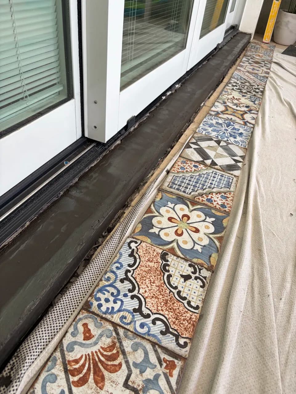 Close view of decorative porcelain during exterior step installation
