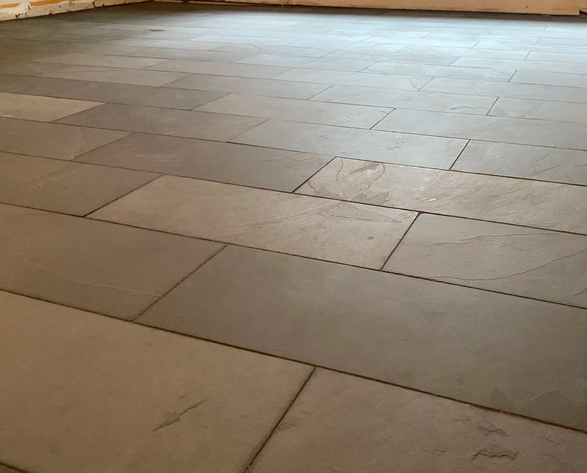 Low view of the slate floor surface and staggered joints