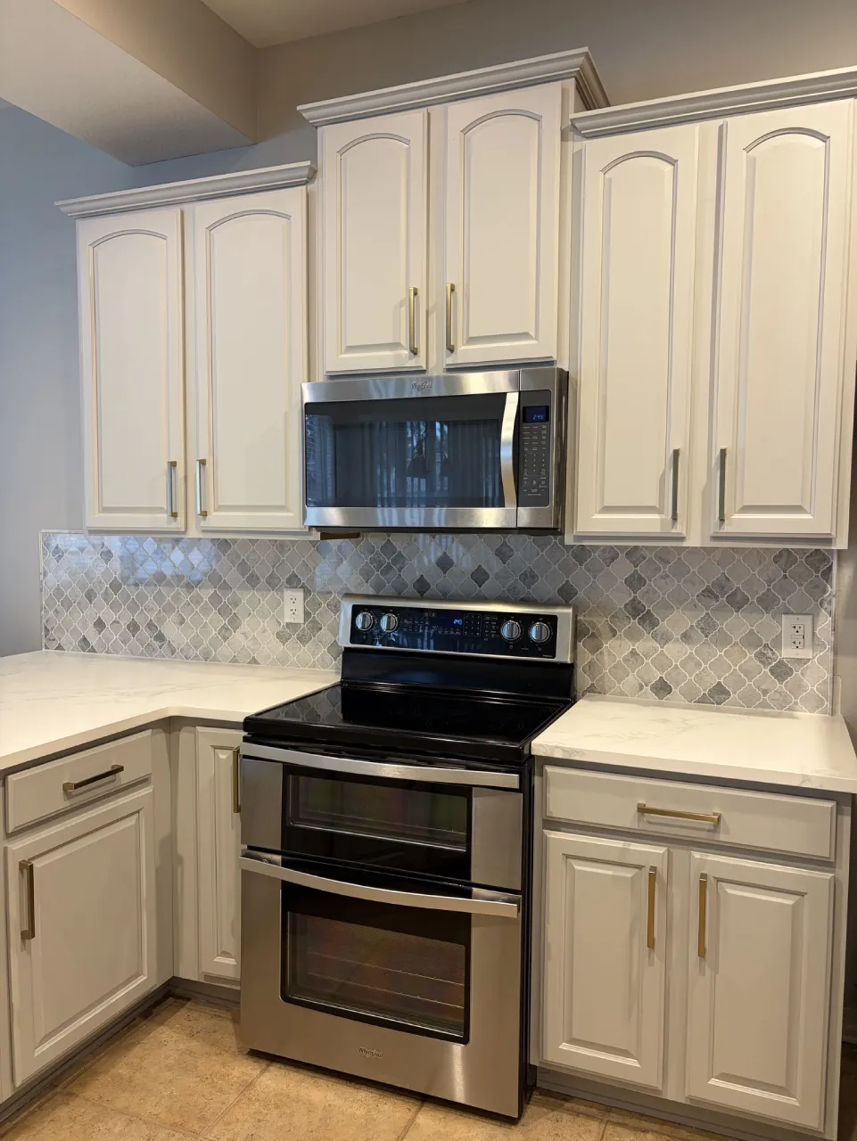 Marble mosaic across the kitchen range wall