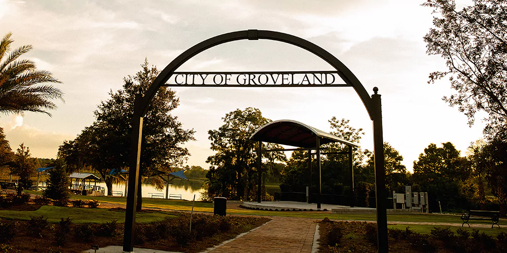 City of Groveland entrance sign with beautiful sunset and lake view